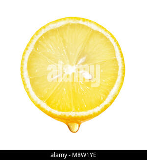 Honey dripping from lemon slice isolated on white background Stock Photo