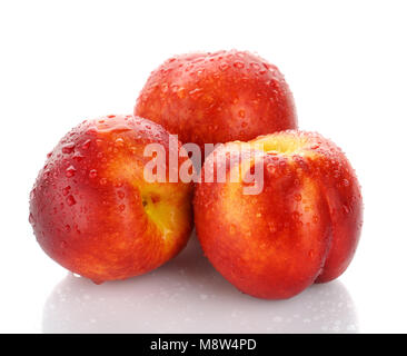Peaches with water drops isolated on white Stock Photo