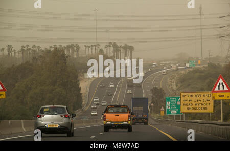 Netanya, Israel - March 08, 2018: Traffic in Highway num.2 in Center of Israel during Massive Spring sandstorm and low visibility.