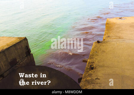 riverscape of large drainage steel pipe background. Stock Photo