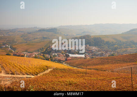 Barolo town in autumn, vineyards with yellow leaves in a sunny day in Italy Stock Photo