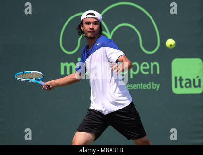 Key Biscayne, Florida, USA. 20th Mar, 2018. Taro Daniel of Japan plays against Thanasi Kokkinakis of Australia during a qualifying round at the 2018 Miami Open presented by Itau professional tennis tournament, played at the Crandon Park Tennis Center in Key Biscayne, Florida, USA. Mario Houben/CSM/Alamy Live News Stock Photo