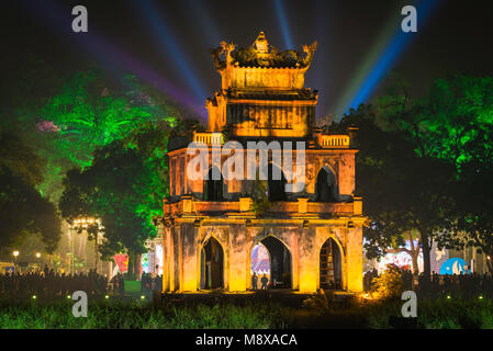 Hanoi Turtle Tower, the old pavilion known as Turtle - or Tortoise - Tower on Hoan Kiem Lake lit by floodlights to celebrate New Year's Eve, Vietnam