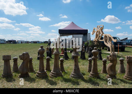 Big wooden chess set by a wood carver at the Gloucestershire Vintage Country Show in Cirencester 2016 Stock Photo