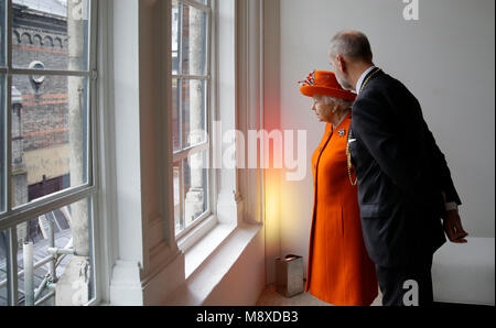 Queen Elizabeth II looks out over ongoing building works during her visit to The Royal Academy of Arts to open the new Burlington Wing and mark the completion of a major redevelopment of the site in the Academy's 250th anniversary year. Stock Photo