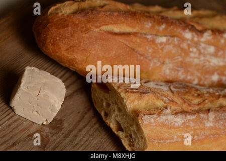 French Bread and fresh yeast on wood Stock Photo