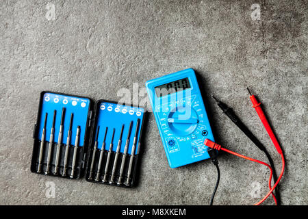 Digital multimeter on grey background Stock Photo