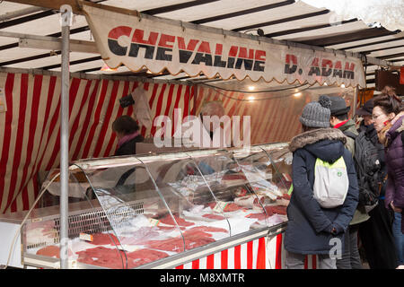 Shopping for horse meat  in Bastille market on a Sunday morning in Paris France Stock Photo