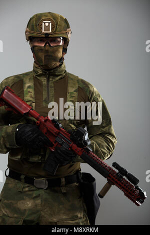 Portrait of military man with gun Stock Photo