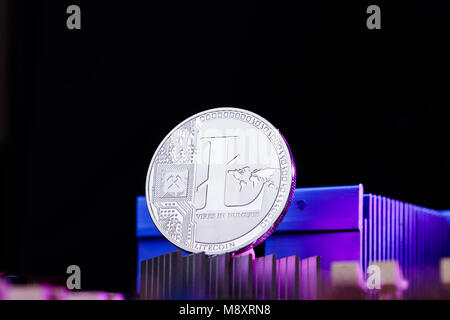 Picture of litecoin and processor on pink background Stock Photo