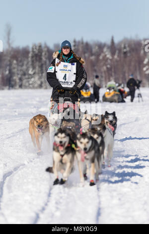 Musher Anna Berington after the restart in Willow of the 46th Iditarod Trail Sled Dog Race in Southcentral Alaska. Stock Photo