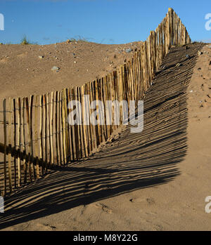 Fencing on sand dunes at Dawlish Warren nature reserve. Stock Photo