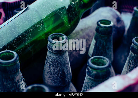 Glass bottles old and damaged by time Stock Photo