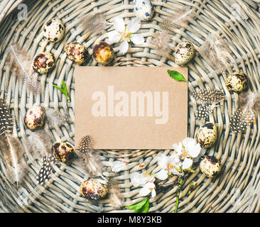 Natural colored quail eggs for Easter in basket Stock Photo