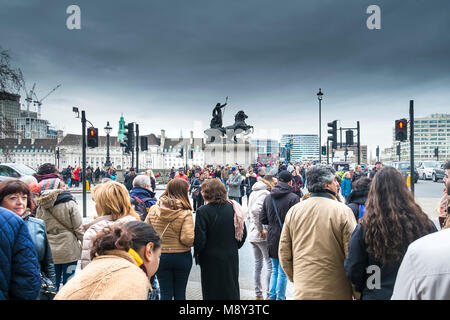 Tourists waiting to cross the road near Westminster Bridge in London. Stock Photo