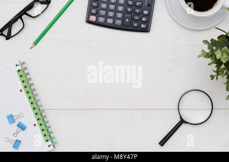 Office desk table layout. Flat lay composition on white wooden background Stock Photo