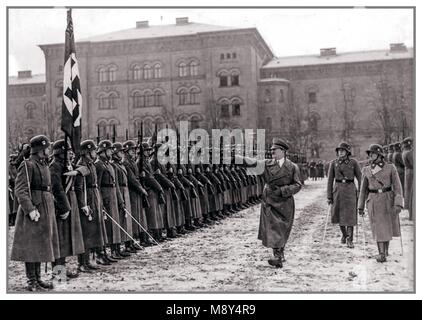 ADOLF HITLER TAKING SALUTE FROM LEIBSTANDARTE PARADE Vintage pre-WW2 black and white photo of men of Leibstandarte 'Adolf Hitler' WAFFEN SS troops at the Lichterfelde barracks in Berlin, Germany, November 22, 1938. Stock Photo