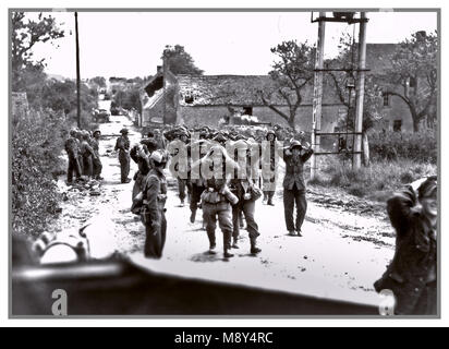 1944 Normandy France German Troops Surrender POW’s WW2 Historic B&W image of Wehrmacht and Waffen SS German troops army forces surrendering with hands up on head, in Saint-Lambert-sur-Dive Normandy France 21 August 1944 Stock Photo