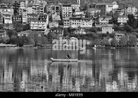 Panoramic view of Kastoria city reflected on the tranquil surface of Orestiada lake, in West Macedonia, Northern Greece Stock Photo