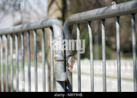 Fence in public park, safety access in entrance. Stock Photo