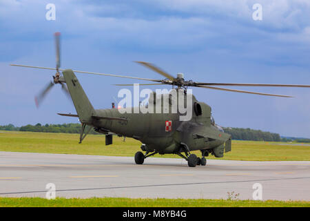 Rear view of the Polish Air Force Mil Mi-24D Hind-D on runway during International Air Show at the 90th Jubilee of The Polish Air Force Academy. Stock Photo