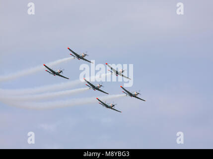 The Polish Air Force Orlik Aerobatics Team flying over sky during International Air Show at the 90th Jubilee of The Polish Air Force Academy. Stock Photo