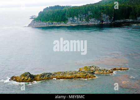 Aerial view of uninhabited areas of Alaska's forested coastline and islands. Stock Photo