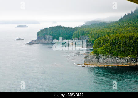 Aerial view of uninhabited areas of Alaska's forested coastline and islands. Stock Photo