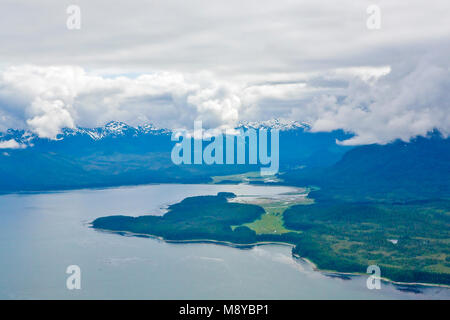 Aerial view of uninhabited areas of Alaska's forested coastline and islands. Stock Photo