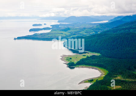 Aerial view of uninhabited areas of Alaska's forested coastline and islands. Stock Photo