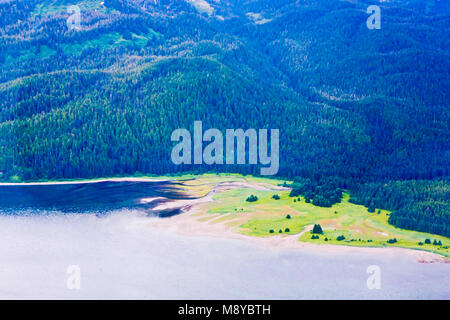 Aerial view of uninhabited areas of Alaska's forested coastline and islands. Stock Photo