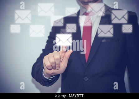 Close up of business hand touch virtual screen, push send email Stock Photo