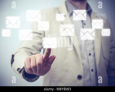 Close up of business hand touch virtual screen, push send email Stock Photo