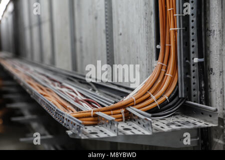 Fibre Optic Network Cables. Fibre channel optical network cables on rails Stock Photo