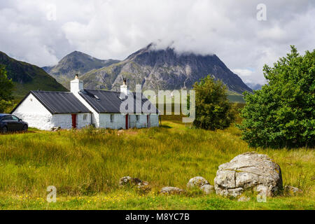 Blackrock Cottage with Buachaille Etive More in the background - Rannoch Moor, at entrance to Glen Coe, Highland Region, Scotland, UK