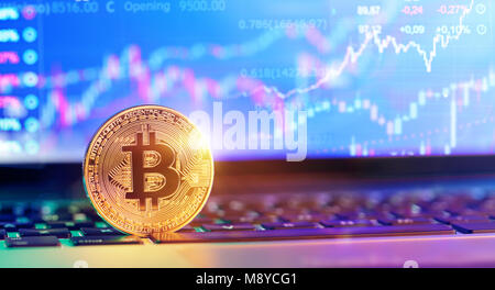 Bitcoin On Laptop With Chart And Quotes Stock Photo
