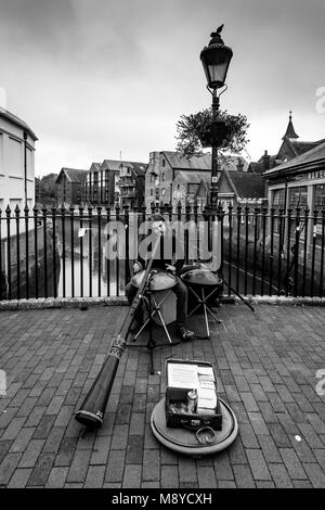 A Man Playing A Didgeridoo In The High Street, Lewes, Sussex, UK Stock Photo