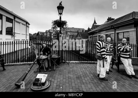 A Man Playing A Didgeridoo In The High Street, Lewes, Sussex, UK Stock Photo