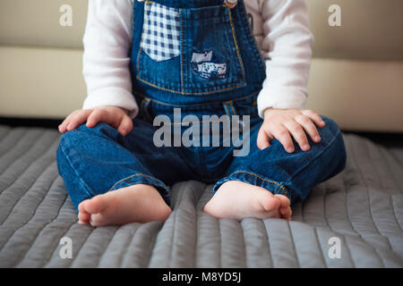 Baby foots close-up in the home bed Stock Photo