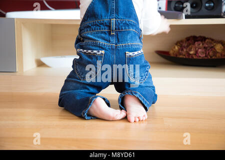 Baby foots close-up on the wooden floor Stock Photo