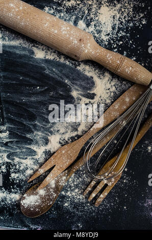 Rural kitchen utensils on blackboard from above - rustic background with free text space. Baking concept. Baking background. Baking preparation. Diffe Stock Photo