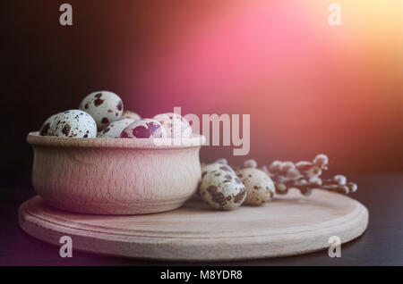 Easter card with quail eggs and willow branches on dark background with empty space. Happy Easter. Easter background with space for text. Copy space. Stock Photo
