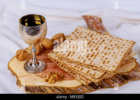 Jewish Matzah on Decorated Silver wine cup with matzah, Jewish symbols for the Passover Pesach holiday. Passover concept. Stock Photo