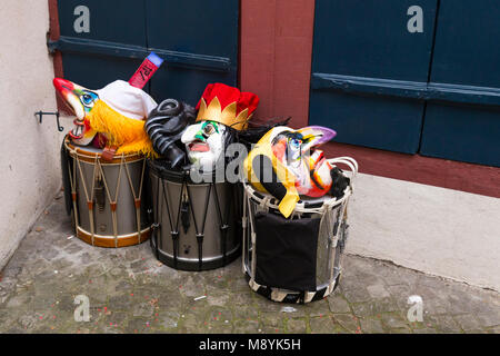 Basel carnival 2018. Pfeffergaesslein, Basel, Switzerland - February 19th, 2018. Close-up of a pile of colorful carnival masks and snare drums Stock Photo