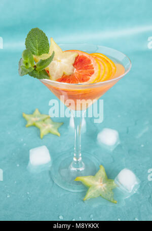 Cold cocktail with fresh bloodoranges and mint leaves Stock Photo