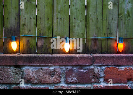 View at three vintage lightbulbs on the old wall Stock Photo