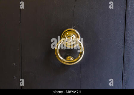 Vintage old door knob from wooden door in Modena, Italy Stock Photo