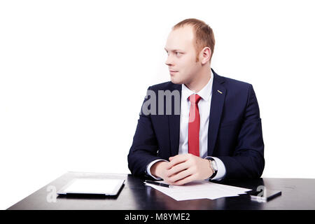 journalist thinking about write news article while working late in an office. Creative editor is working on a new project. Skilled businessman in maki Stock Photo