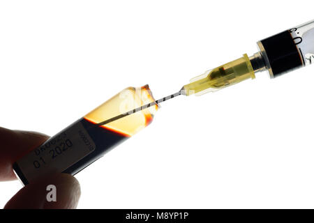 Vial and Syringe, Preparing for an Injection of Iron, used in the treatment of Anemia, Close Up