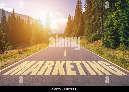 Marketing word written on road in the mountains Stock Photo